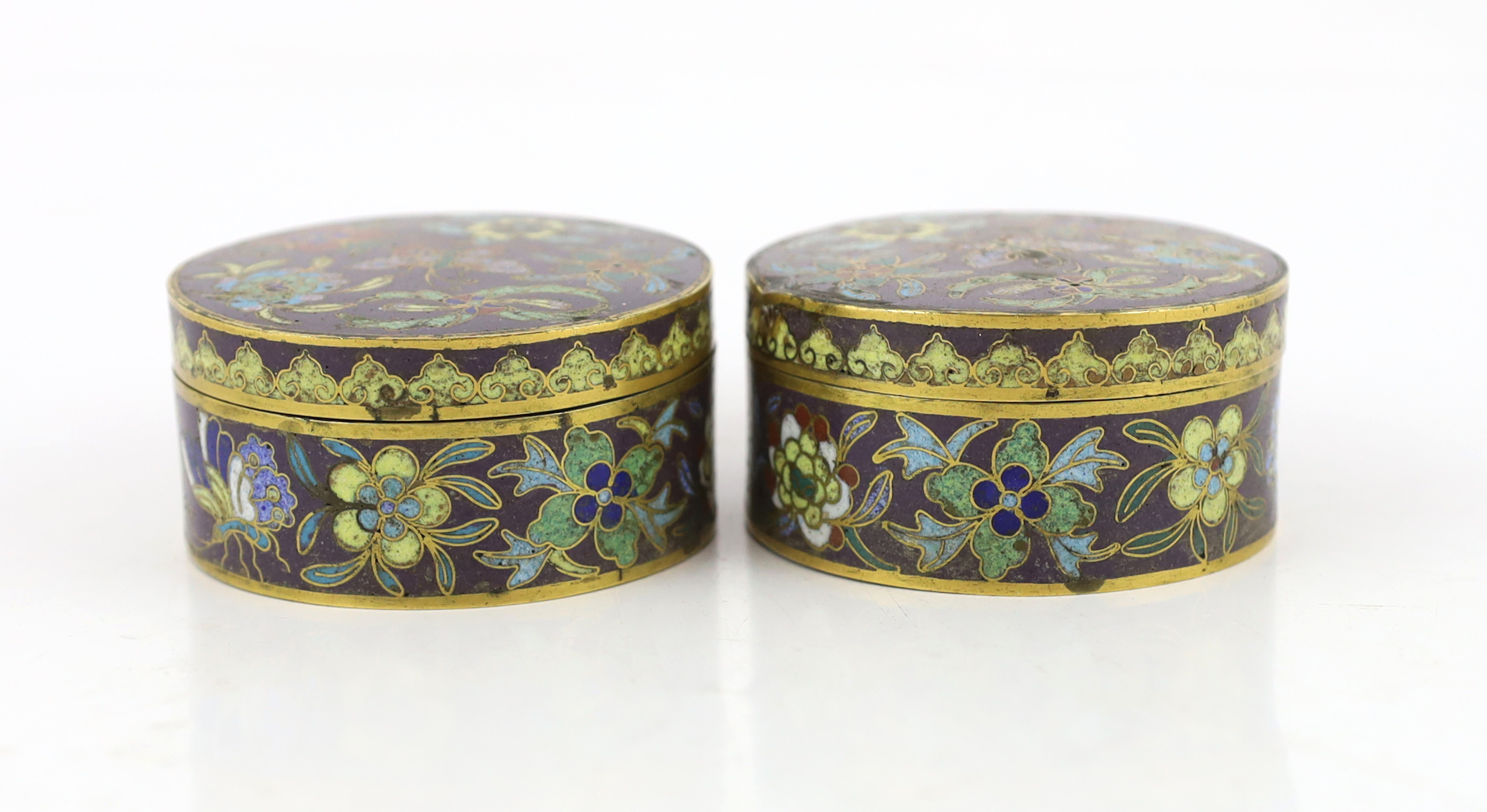 A pair of Chinese purple ground cloisonné enamel circular boxes and covers, 19th century, small losses enamel